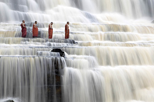 Meditating Monks At Pongour Falls